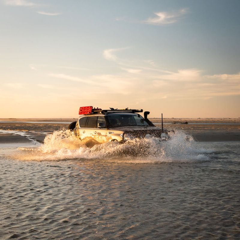 Four-wheel drive attempting water crossing