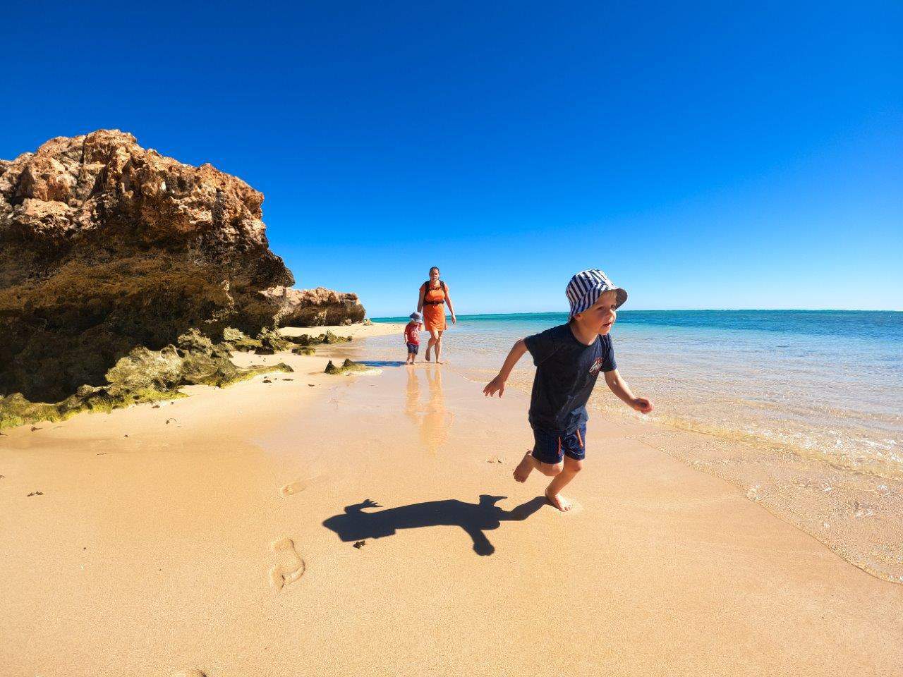 kids running on beach